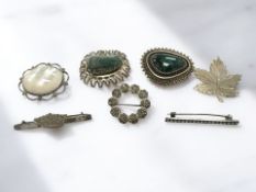 Seven silver brooches