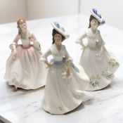 A Royal Doulton figure 'Margaret' HN2397, together with 'Tender Moment' HN3303, and 'Adele' HN2480.