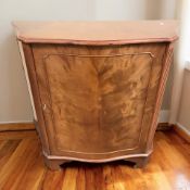 A reproduction mahogany serpentine front single door side cabinet, 102 cm x 43 cm x 87 cm.