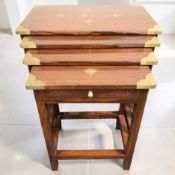 An Eastern hardwood and brass inlaid nest of four tables, width 54 cm.