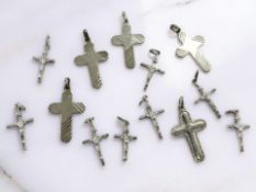 Eleven silver crucifix pendants CONDITION REPORT: 35g