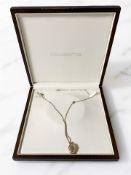 A 9ct gold locket on 9 ct gold chain, in Goldsmiths box. CONDITION REPORT: 9.