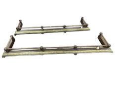 A pair of 19th century steel and brass fire curbs, overall length 153 cm.