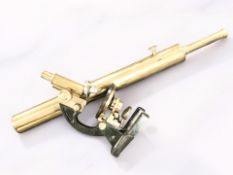 A J Swift & Son London brass microscope, numbered 18552, together with a brass telescope.