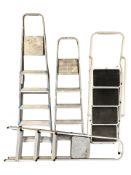 Four various step ladders.