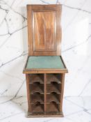 A small mahogany collector's cabinet with compartmentalised interior, height 34 cm.