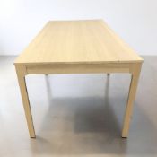 A modern oak veneered dining table, 180 cm x 90 cm x 75 cm.