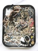 A large quantity of costume bead necklaces, simulated pearls, bangles, etc.