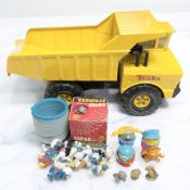 A Tonka truck and other various toys.
