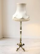 A brass and onyx standard lamp.