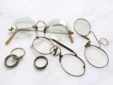 A 9ct gold and silver full eternity ring, other dress rings, gold-plated spectacles,