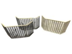 Three 19th century steel and brass spark guards, width 68 cm.
