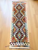 A Chobi Kilim runner, 157 cm x 50 cm.