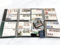 Four albums of first day covers, various stamps including mint examples.