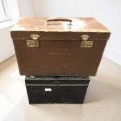 A lacquered tin trunk and a leather trunk, largest 60 cm wide.