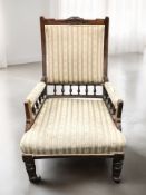 A Victorian walnut salon armchair, width 66 cm.