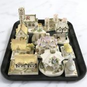 A group of Coalport porcelain cottages.