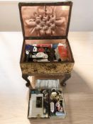 A 20th century sewing work box on cabriole legs.