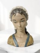 A Lladro bust of a girl, height 33 cm.