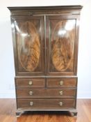 A Regency style mahogany and satinwood inlaid linen press, late 19th century, with two door cabinet,
