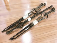 A group of 19th century steel fire pokers and tongs.