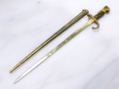 A French Epee bayonet dated 1879, in black painted metal scabbard.