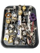 A group of miniature timepieces, wristwatches, pocket watch, etc.