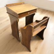 A vintage child's writing desk, width 52 cm, and a seat.