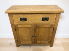 A modern oak double door side cabinet, 80 cm x 33 cm x 80 cm.