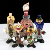 Four Murano glass clowns, tallest 35 cm.