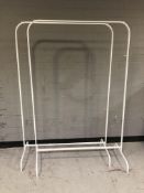 A pair of metal clothes rails, width 100 cm.