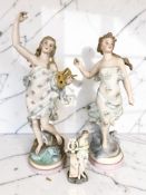 A pair of continental bisque porcelain figures of ladies, one holding a lute, height 46 cm,