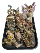 A group of contemporary fairy ornaments.