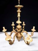 A 20th century gilt composition six branch chandelier, height 83 cm.