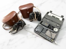 A pair of Carl Zeiss Jena Jenoptem multi-coated 10x50W binoculars, numbered 6406877,