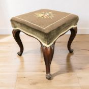 A Victorian carved mahogany square stool with needlepoint top, width 47 cm.