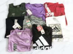 Eight various Adidas and Nike shirts, with retail tags.