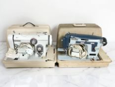 Two Newhome electric sewing machines with leads and pedals.