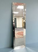 A contemporary Habitat frameless mirror, 61 cm x 201 cm.
