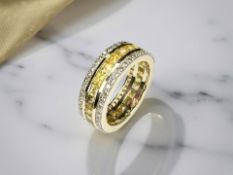 A 14ct gold yellow sapphire and diamond eternity ring, size M CONDITION REPORT: 5.