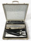 A Hohner Atlantic IV N accordion, in case.