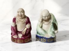 A Royal Worcester Connoisseur Collection figure 'Sleeping Buddha' and another figure 'Smiling