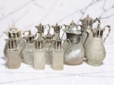 A collection of pressed glass claret jugs.