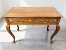 An Eastern hardwood and brass inlaid two drawer side table on cabriole legs, 106 cm x 55 cm x 77 cm.
