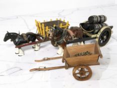 Two ceramic shire horses with carts.