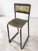 A mid-century metal framed stool with Squaw Canning Company advertising label applied to back rest,