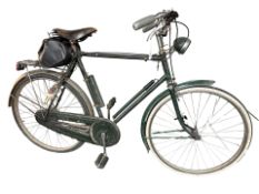 A vintage bike marked 'The All Steel bicycle', fitted with a battery powered torch, frame 25