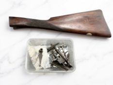 A walnut stock and the disassembled action of a BSA 12 bore shotgun.