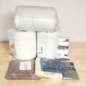 A quantity of new bed linen including sheets, duvets, etc.