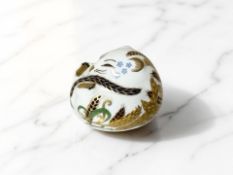 A Royal Crown Derby sleeping dormouse paperweight, silver stopper.